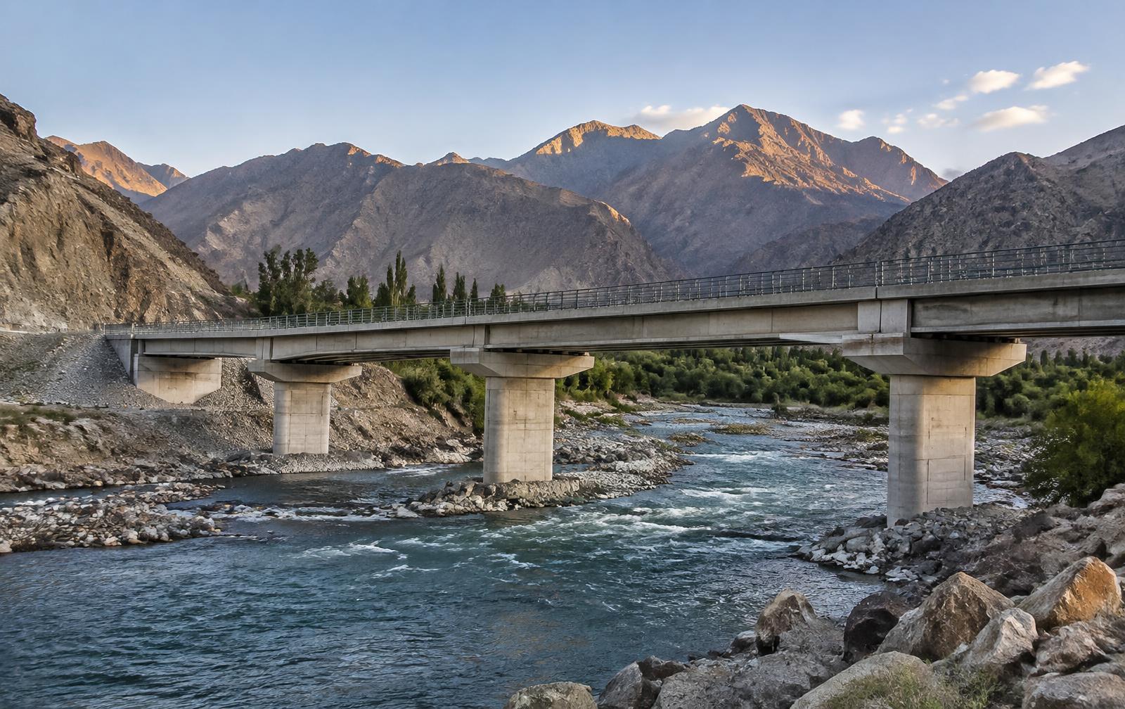 Concrete bridge crossing a mountain river